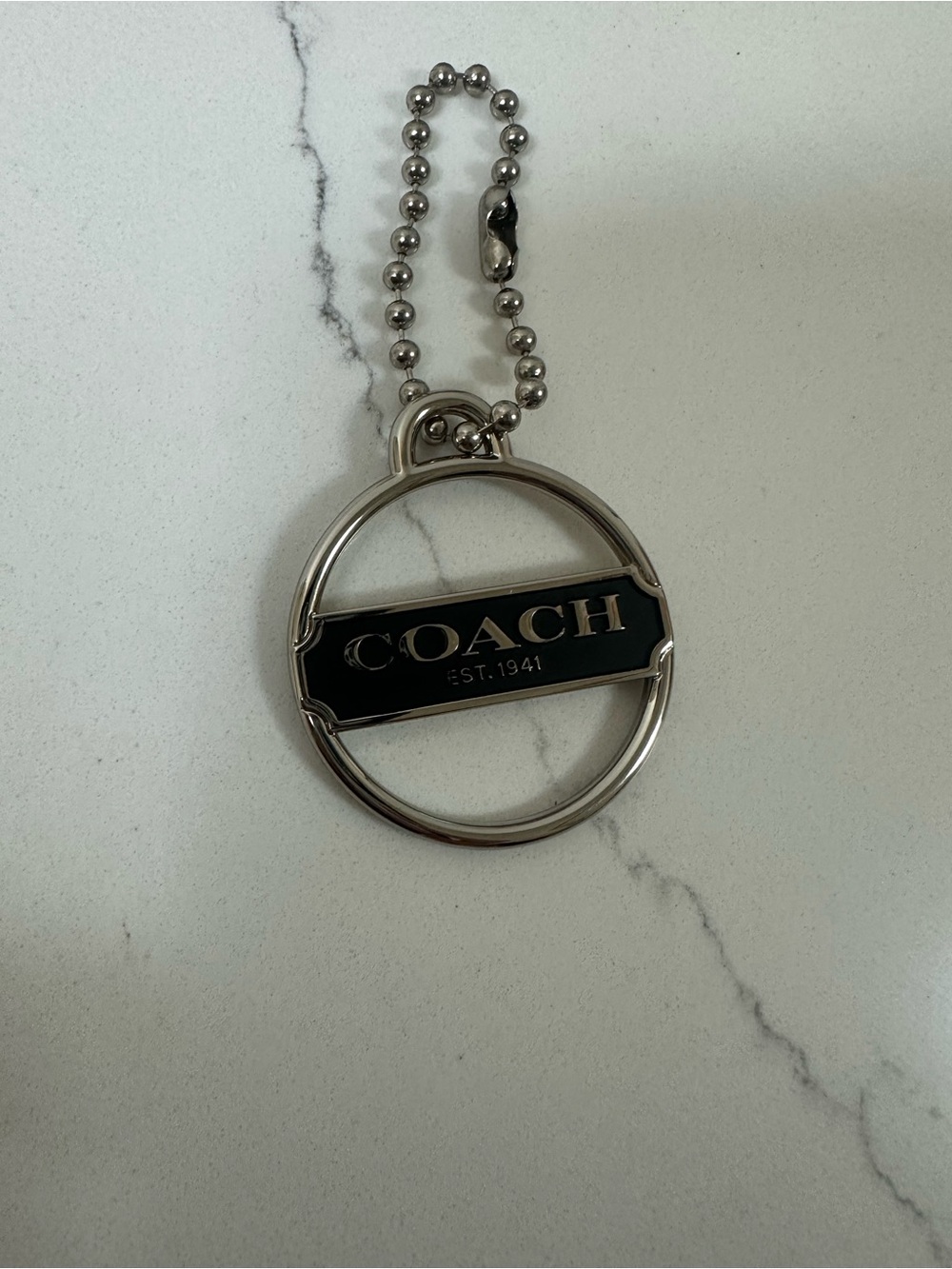 COACH Black and Silver Logo metal bag charm